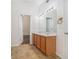 Bright bathroom features a double vanity, large mirror, and tile flooring at 4139 Magnolia Glen Walk, Norcross, GA 30093