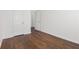 Bedroom featuring hardwood floors, baseboard trim and window with blinds at 4139 Magnolia Glen Walk, Norcross, GA 30093