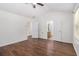 Primary bedroom with hardwood floors, ceiling fan and ensuite bath at 4139 Magnolia Glen Walk, Norcross, GA 30093