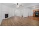 Open-concept living area with fireplace flows into the kitchen, enhancing the home's layout at 4139 Magnolia Glen Walk, Norcross, GA 30093