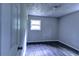 Bright bedroom featuring a neutral paint color and vinyl flooring at 5904 Heatherwood Ln, Riverdale, GA 30296