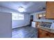 Functional kitchen featuring vinyl flooring, ample cabinet space, and a gas range at 5904 Heatherwood Ln, Riverdale, GA 30296