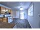 Well-lit kitchen with vinyl flooring, white appliances, and plenty of counter space at 5904 Heatherwood Ln, Riverdale, GA 30296