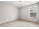 Neutral bedroom featuring carpet, a window with blinds, and fresh paint at 867 Crested Hawk Trl, Sugar Hill, GA 30518