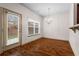 Bright dining room with hardwood floors and a chandelier, perfect for Gathering meals at 867 Crested Hawk Trl, Sugar Hill, GA 30518