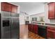 Open kitchen and living room layout with modern appliances and a cozy fireplace at 867 Crested Hawk Trl, Sugar Hill, GA 30518