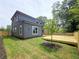A backyard view of a new home with a wood deck and a freshly planted tree at 1197 Avondale Se Ave, Atlanta, GA 30312