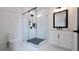 Modern bathroom featuring a glass shower, toilet, vanity, and black hardware accents at 1197 Avondale Se Ave, Atlanta, GA 30312
