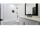 Elegant bathroom featuring a bathtub, shower, modern vanity, and stylish tile work at 1197 Avondale Se Ave, Atlanta, GA 30312