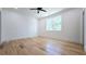 Bright bedroom featuring hardwood floors, white trim, and a large window for natural light at 1197 Avondale Se Ave, Atlanta, GA 30312