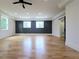Bright and airy bedroom featuring wood floors, recessed lighting, dark accent wall, and sliding barn door to Primary bath at 1197 Avondale Se Ave, Atlanta, GA 30312