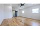 Spacious bedroom featuring wood flooring and a modern barn door leading to a bathroom at 1197 Avondale Se Ave, Atlanta, GA 30312