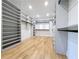Bright walk-in closet with custom shelving, drawers, and light hardwood flooring for organized storage at 1197 Avondale Se Ave, Atlanta, GA 30312
