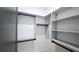 Custom walk-in closet with multiple shelves and hanging racks for optimal storage solutions at 1197 Avondale Se Ave, Atlanta, GA 30312