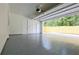 Bright and clean two-car garage with epoxy flooring, ample space, and access to the backyard at 1197 Avondale Se Ave, Atlanta, GA 30312