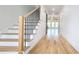 Hallway features hardwood floors, stairs, and an open concept living room with natural light at 1197 Avondale Se Ave, Atlanta, GA 30312