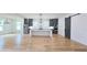 Modern open kitchen design with island and stainless steel appliances and a sliding barn door at 1197 Avondale Se Ave, Atlanta, GA 30312