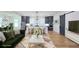 Open-concept living room and kitchen area, featuring hardwood floors and modern finishes at 1197 Avondale Se Ave, Atlanta, GA 30312