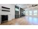 Open-concept living room with a modern fireplace, wine cooler and lots of natural light at 1197 Avondale Se Ave, Atlanta, GA 30312