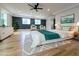 Spacious main bedroom with hardwood floors, recessed lighting, dark accent wall, and sitting area at 1197 Avondale Se Ave, Atlanta, GA 30312