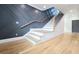 Stylish staircase with decorative wall paneling and wooden handrail at 1197 Avondale Se Ave, Atlanta, GA 30312