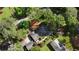 Aerial view showcases a home with a yard, patio, and a large tree-covered lot at 1280 Sherry Dr, Alpharetta, GA 30009