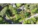 Aerial view of a house with mature trees surrounding the home and property at 1280 Sherry Dr, Alpharetta, GA 30009