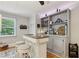 This bar area features ample storage space with a built-in cabinet, counter, and shelves at 1280 Sherry Dr, Alpharetta, GA 30009