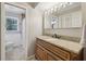 Inviting bathroom featuring a wood vanity with a granite countertop, adding warmth and style at 1280 Sherry Dr, Alpharetta, GA 30009