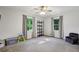 Spacious bedroom features a ceiling fan, two windows with curtains, carpet, and a toy area at 1280 Sherry Dr, Alpharetta, GA 30009