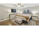 Cozy bedroom featuring a comfortable bed, stylish dresser, and decorative rug on hardwood flooring at 1280 Sherry Dr, Alpharetta, GA 30009