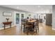 Dining area features a table with seating for six, French doors to a patio, and hardwood floors at 1280 Sherry Dr, Alpharetta, GA 30009