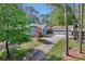 A neatly kept home with a detached garage and a long driveway lined with mature trees at 1280 Sherry Dr, Alpharetta, GA 30009