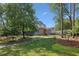 Inviting home with stone accents, mature landscaping, and a well-maintained lawn offering great curb appeal at 1280 Sherry Dr, Alpharetta, GA 30009