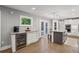 Bright, open kitchen with an island, white cabinets, and stainless steel appliances at 1280 Sherry Dr, Alpharetta, GA 30009