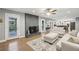 Bright and spacious living room with a brick fireplace and access to the backyard at 1280 Sherry Dr, Alpharetta, GA 30009