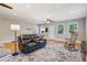 Relaxing living room offering ample seating, hardwood floors, ceiling fans, and natural light at 1280 Sherry Dr, Alpharetta, GA 30009