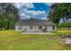 The backyard boasts a patio ideal for barbeques, surrounded by green lawns at 1959 Christian Circle, Conyers, GA 30013