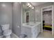 Bathroom with double sink vanity, tile floors and a walk-in closet at 1959 Christian Circle, Conyers, GA 30013
