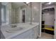 Bright bathroom featuring a double sink vanity, tile flooring and an entry to the walk in closet at 1959 Christian Circle, Conyers, GA 30013