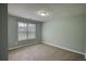 Bedroom with large window and carpet at 1959 Christian Circle, Conyers, GA 30013