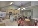 Open floor plan with an eat-in kitchen featuring stainless steel appliances and a large island with bar seating at 1959 Christian Circle, Conyers, GA 30013