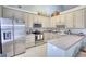 Neutral colored kitchen with stainless steel appliances, granite countertops and tile backsplash at 1959 Christian Circle, Conyers, GA 30013