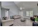 Bright and airy living room with high ceilings, hard surface flooring, and plenty of natural light at 1959 Christian Circle, Conyers, GA 30013