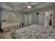 Spacious main bedroom featuring a decorative trey ceiling with a walk in closet and en suite bathroom at 1959 Christian Circle, Conyers, GA 30013
