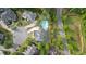 Well-manicured estate boasting an in-ground pool, mature trees, and a circular driveway, offering privacy and charm at 212 Fernwood Pl, Woodstock, GA 30188