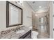 Well-lit bathroom features a granite vanity, walk-in glass shower with seat, and neutral tile at 212 Fernwood Pl, Woodstock, GA 30188