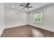 Clean bedroom featuring a ceiling fan and white shutters with plenty of natural light at 212 Fernwood Pl, Woodstock, GA 30188
