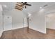 Large bedroom features hardwood floors, a fan and access to a walk in closet at 212 Fernwood Pl, Woodstock, GA 30188