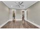 Spacious bedroom boasts hardwood floors, neutral paint, crown molding, and great lighting at 212 Fernwood Pl, Woodstock, GA 30188